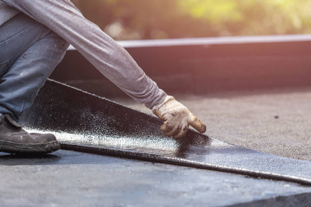 Professional Basement Waterproofing technician working in Kensington, NY
